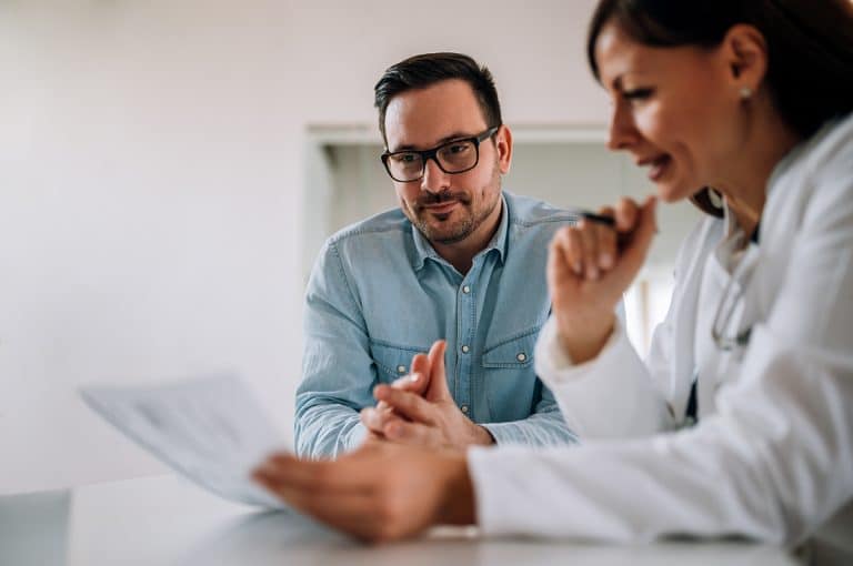 Doctor and patient looking over test results